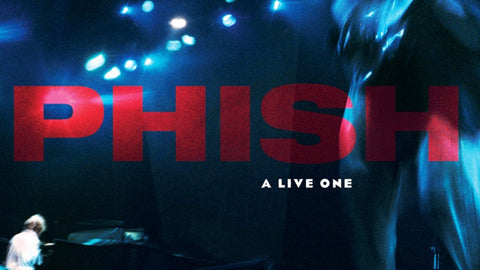 PHISH A LIVE ONE concert image featuring vibrant stage lights and musicians performing.