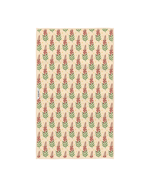 Back of Alaska kitchen tea towel with repeating red fireweed flower pattern on cream Grip-Tex fabric