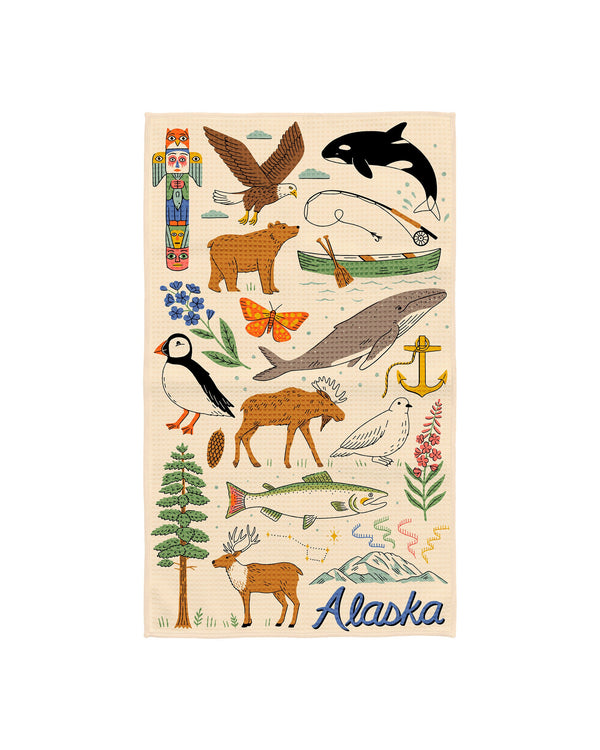 Alaska kitchen tea towel illustrated with bald eagle, orca, brown bear, moose, puffin, whale, salmon and totem pole on cream