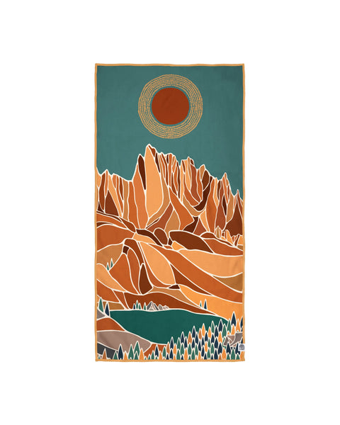 Alpenglow Wander Towel featuring a unique mountain and sun design, made from recycled materials and perfect for travel with quick-dry technology.