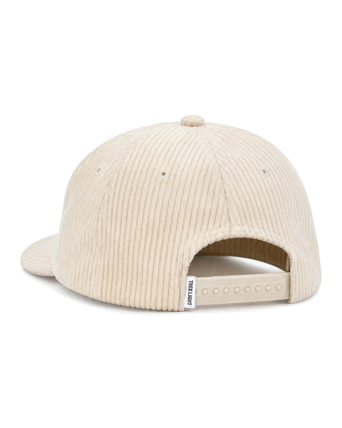 Back view of the Big Fan Of Fun Hat in cream corduroy with a lightly curved brim and a snap closure, on white.