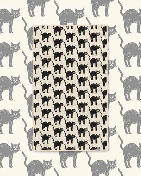 Black Cats Kitchen & Tea Towel with black arched-back cats in rows on a cream background