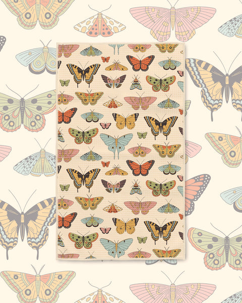 Butterfly Beauty Kitchen & Tea Towel with butterflies and moths in orange, yellow and green on a cream background
