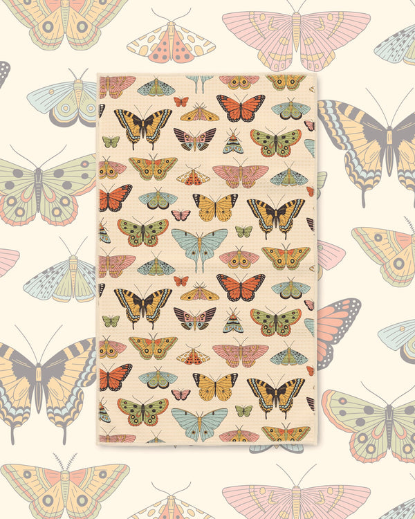 Butterfly Beauty Kitchen & Tea Towel with butterflies and moths in orange, yellow and green on a cream background