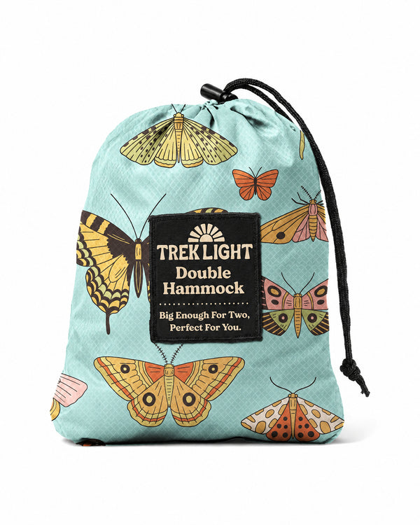 Double Hammock in Butterfly Dreams, a teal drawstring stuff sack with a colorful butterfly and moth print, on white.