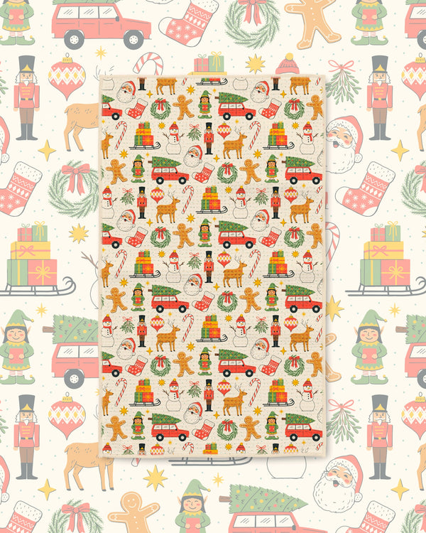 Holiday kitchen tea towel with festive Christmas icons on a matching cream pattern backdrop