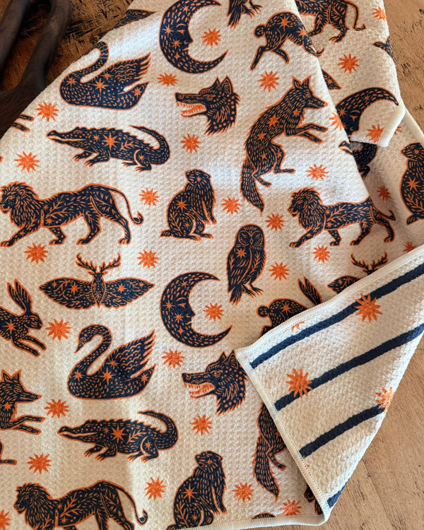 Cosmic Creatures Kitchen & Tea Towel featuring vibrant animal prints and celestial designs.