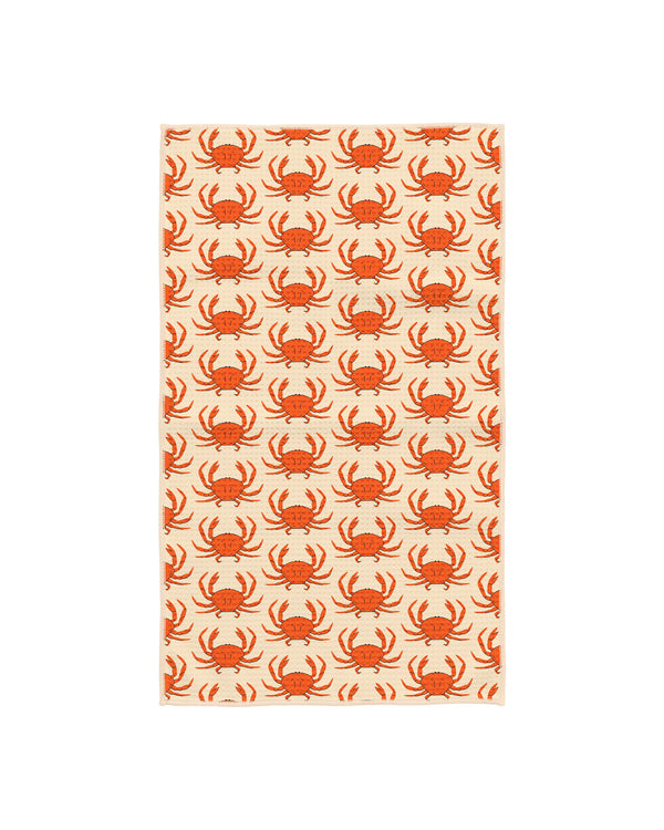 Kitchen tea towel with orange crab pattern on cream waffle-weave fabric, large crabs scattered across the towel with a