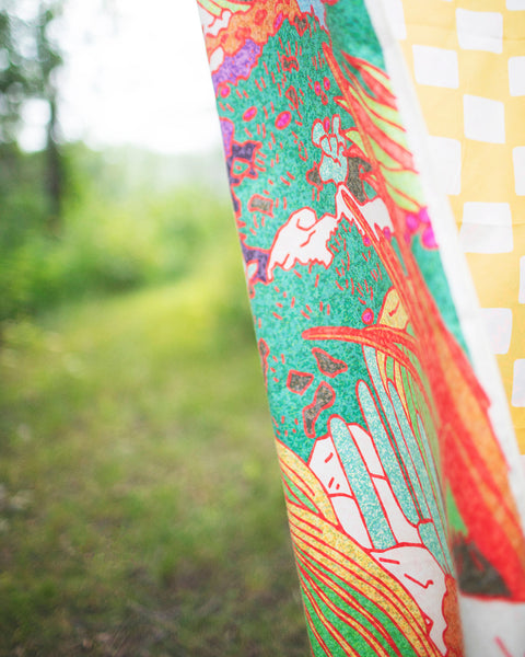 Desert Dreams Wander & Travel Towel showcasing vibrant desert-themed design in a natural setting.