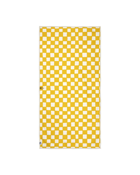 Yellow checkered Desert Dreams Wander & Travel Towel, quick-dry, sand-resistant, made from recycled materials, with hanging loop.