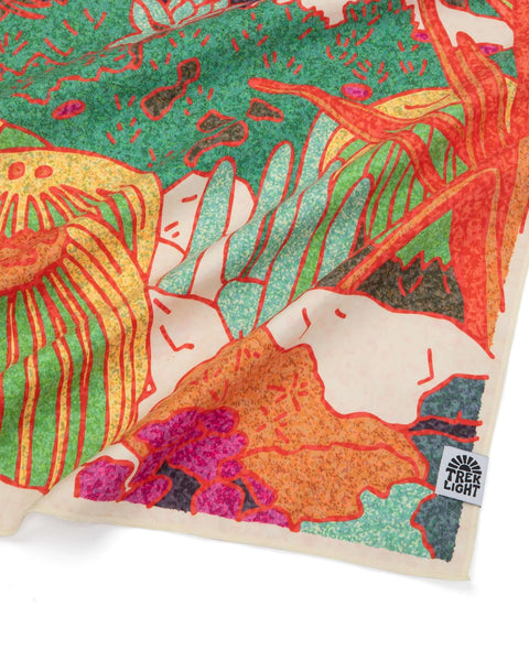 Colorful abstract Trek Light cloth with nature-inspired design in vibrant greens, oranges, and yellows.