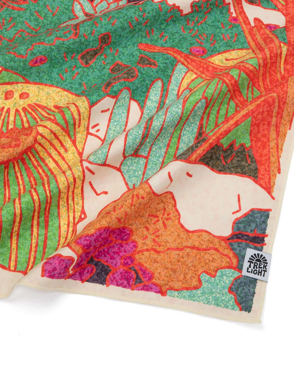 Colorful abstract Trek Light cloth with nature-inspired design in vibrant greens, oranges, and yellows.