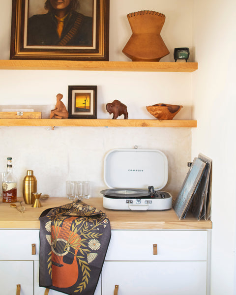 Dinner Music Kitchen & Tea Towel draped over kitchen counter with a record player and decor.