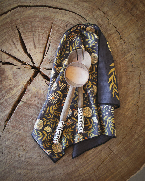 Dinner Music Kitchen & Tea Towel featuring floral design and wooden utensils on a rustic wood surface.