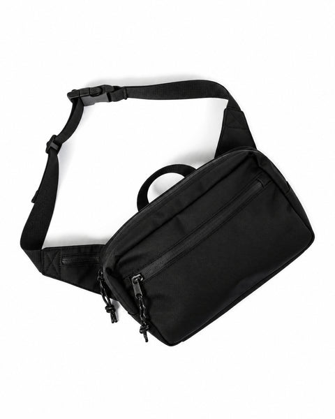 Everyday Fanny Pack (Eclipse) with multiple zippered pockets and adjustable strap, ideal for travel and daily use.