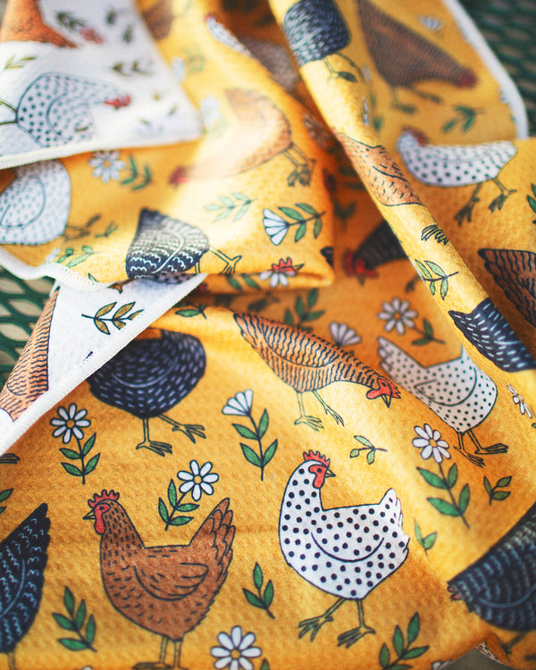 Farmhouse Chicken Kitchen & Tea Towel featuring colorful chicken patterns on a yellow background.