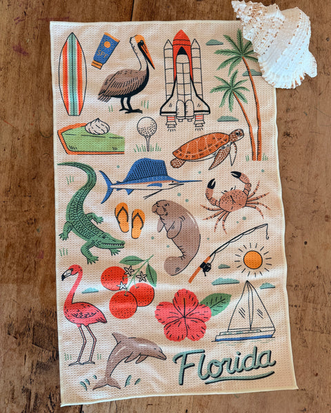 Florida Kitchen & Tea Towel featuring vibrant illustrations of Florida's wildlife and beach themes.