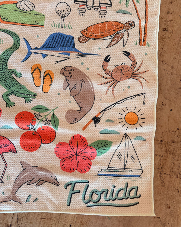 Colorful design featuring Florida wildlife and scenery on a Florida Kitchen & Tea Towel.