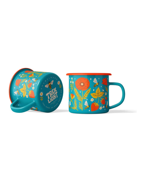 Garden Buzz Enamel Mug 16oz with floral design and vibrant colors, perfect for campfire or cozy mornings. Lightweight and durable enamelware.
