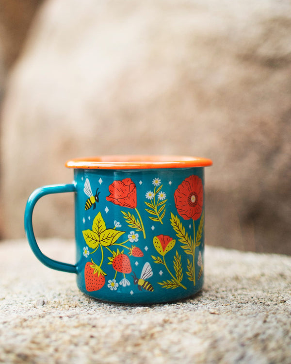 Garden Buzz Enamel Mug 16oz featuring vibrant flowers and bees, perfect for outdoor adventures by Trek Light.