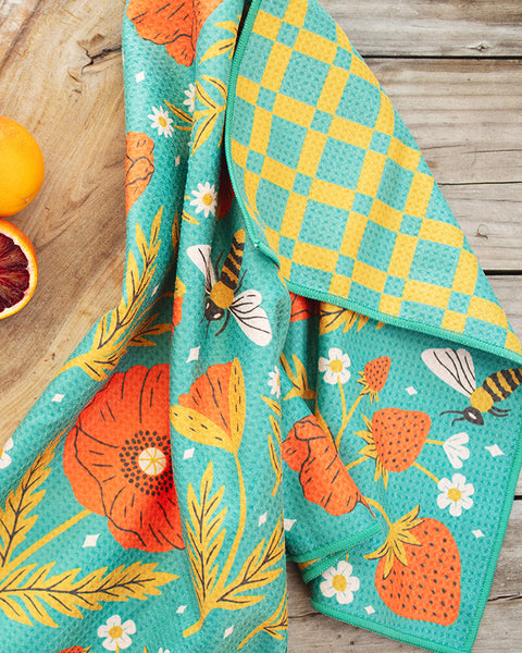 Garden Buzz Kitchen & Tea Towel featuring vibrant floral and bee designs, perfect for cooking with style.