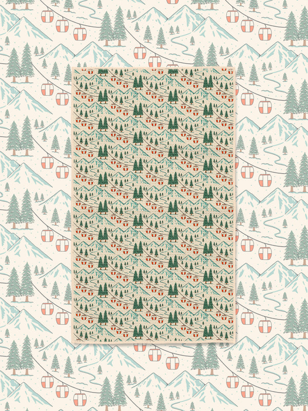 Close-up of Gondola Winter microfiber towel showing detailed snowy mountains, red gondola cars, and pine forest print