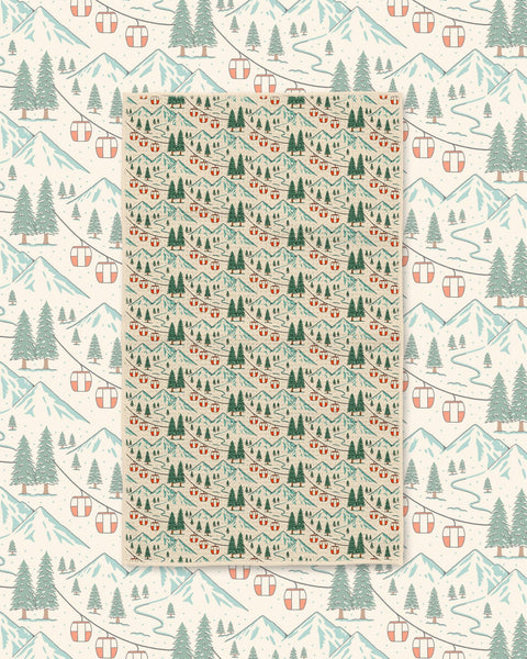 Close-up of Gondola Winter microfiber towel showing detailed snowy mountains, red gondola cars, and pine forest print