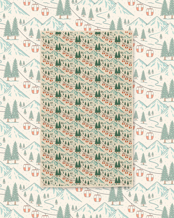 Close-up of Gondola Winter microfiber towel showing detailed snowy mountains, red gondola cars, and pine forest print