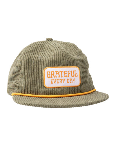 Trek Light Grateful Every Day green corduroy snapback hat with flat brim and stylish vent holes.