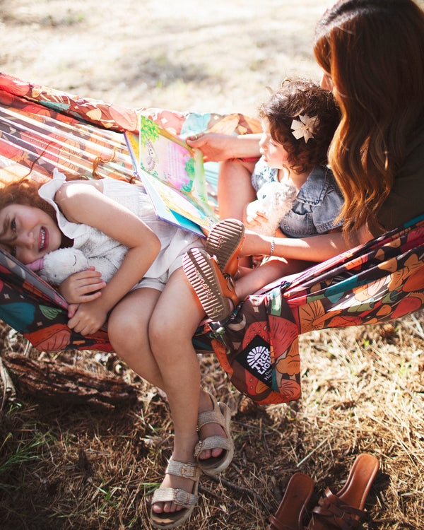Double Hammock & Pro Hanging Straps (Midnight Mushroom Print) - Family enjoying reading in a colorful hammock.