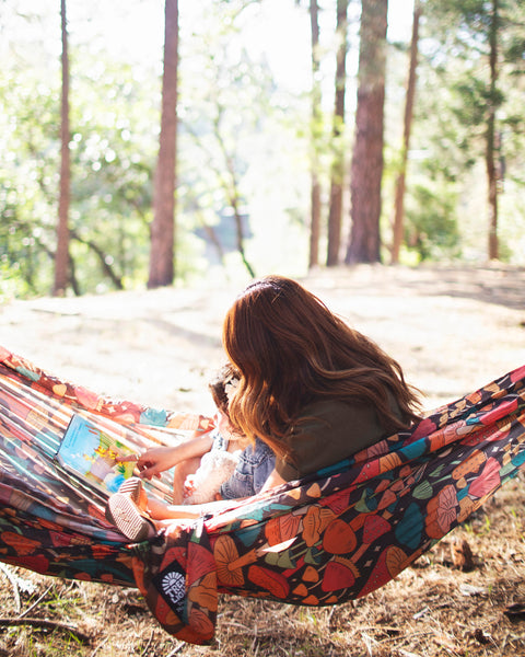 Double Hammock & Pro Hanging Straps (Midnight Mushroom Print) in use outdoors with a woman and child.