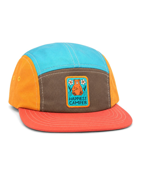 Happiest Camper Kids Hat, a five-panel cap in blue, brown, yellow and red with a orange bear patch, on white.