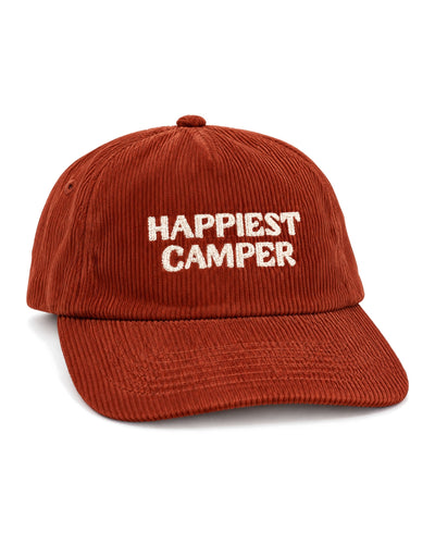Happiest Camper Hat in rust red corduroy with white stitched "HAPPIEST CAMPER" lettering on the front, on white.