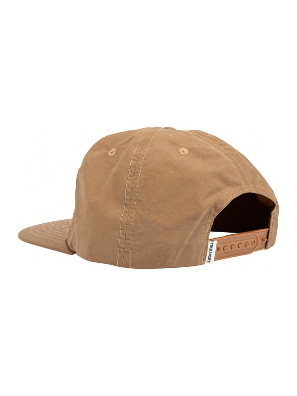 Back view of the Howdy Hat, a 5-panel snapback in beige nylon with vent holes, flat brim, and adjustable strap by Trek Light.