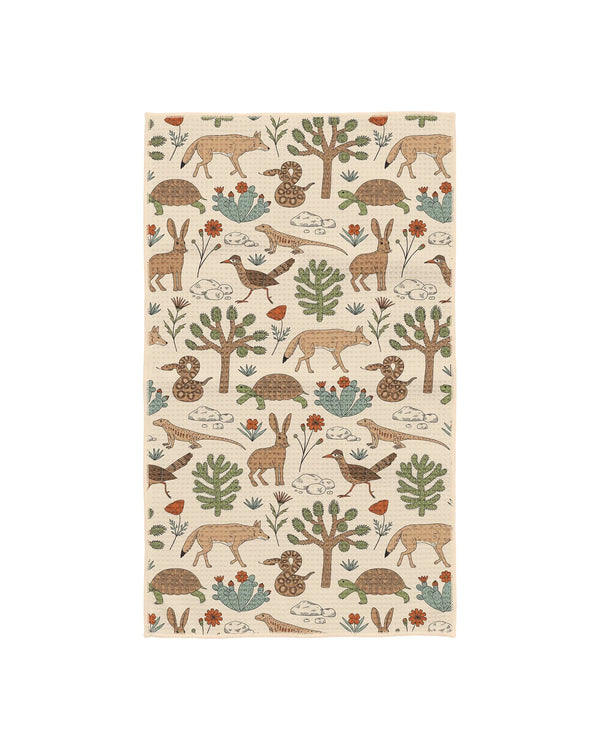 Joshua Tree kitchen tea towel in cream with hand-drawn desert animals including coyotes, rabbits, tortoises, lizards.