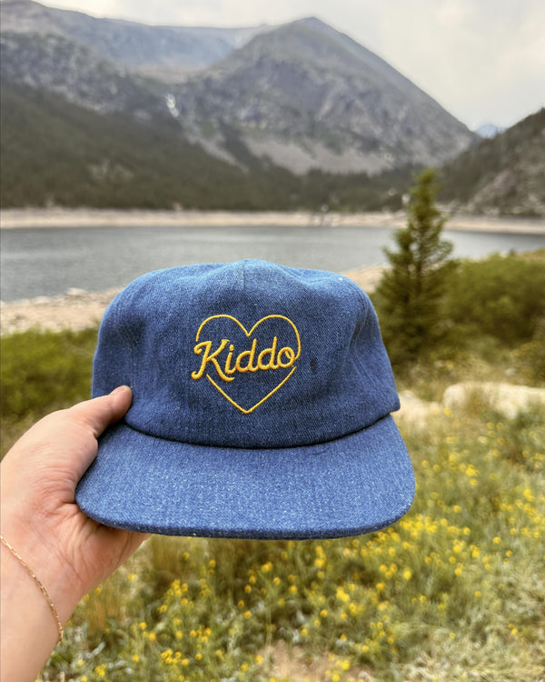 Kiddo Kids Hat displayed against a scenic mountain backdrop, perfect for sunny adventures and little explorers.