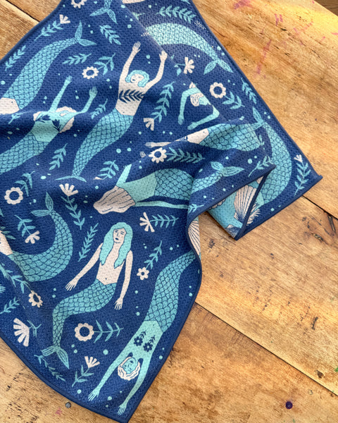 Mermaids Kitchen & Tea Towel with beautiful mermaid design on blue background, perfect for any kitchen decor.