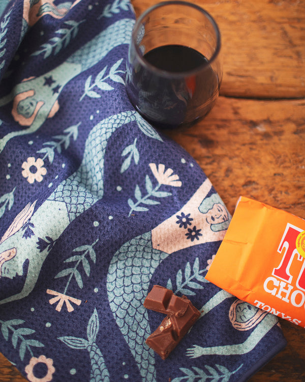 Mermaids Kitchen & Tea Towel with a glass of wine and chocolate