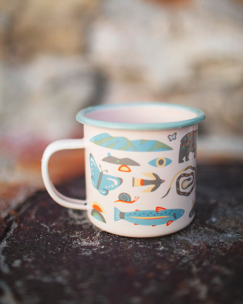 Mountain Stream Enamel Mug 16oz with colorful nature motifs, perfect for outdoor adventures or cozy mornings at home.