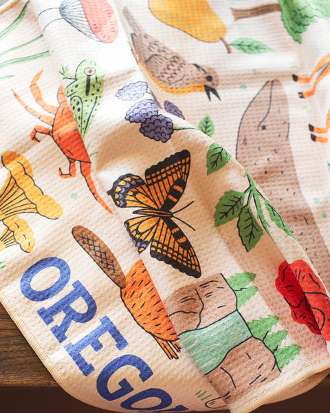 Vibrant Oregon Kitchen & Tea Towel featuring colorful designs of nature and wildlife, perfect for everyday use.