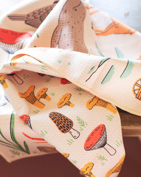 Oregon Kitchen & Tea Towel showcasing colorful mushroom patterns, eco-friendly and super absorbent for versatile kitchen use.
