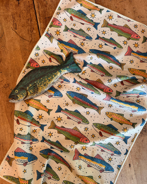 Colorful River Trout Kitchen & Tea Towel featuring various trout designs on a textured background.