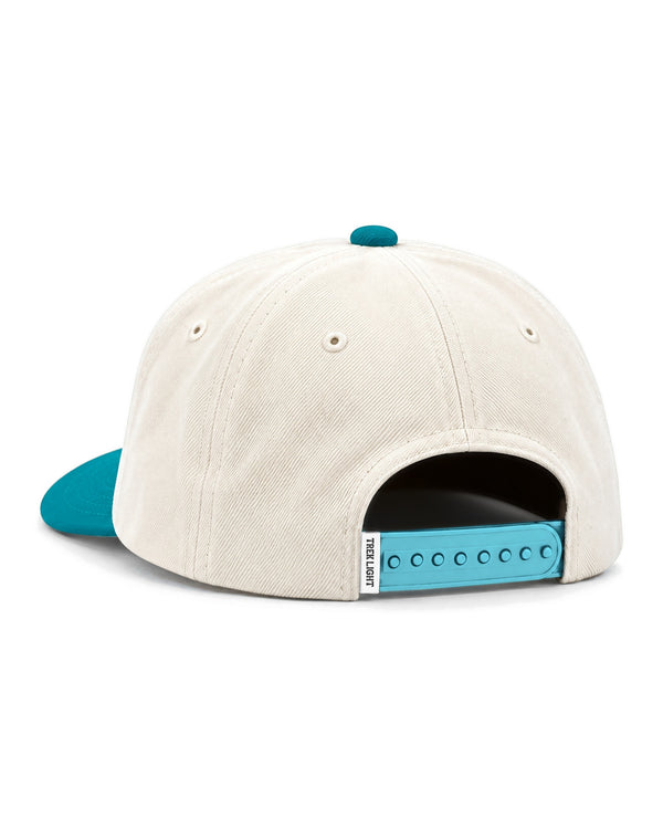 Rock N Roll Kids Hat in beige with a teal brim, teal snap strap and a small woven tag, on white