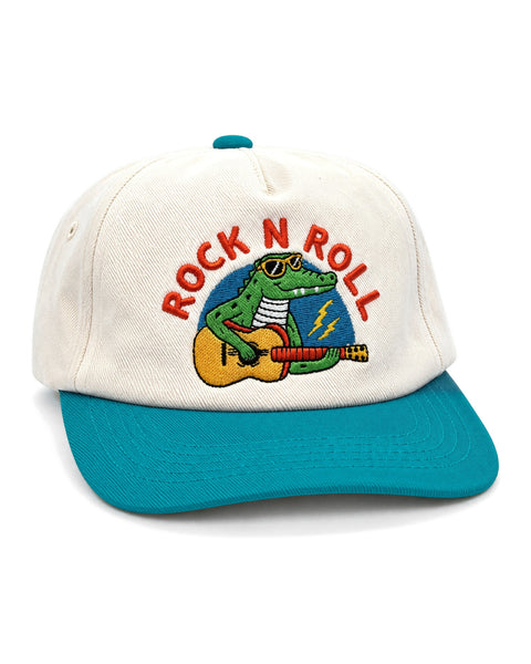 Rock N Roll Kids Hat in cream with a teal brim, embroidered with a sunglasses-wearing alligator playing guitar, on white.