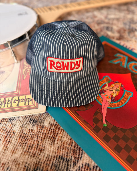 Rowdy Hat displayed on a colorful background with musical instruments, showcasing its unique design and style.