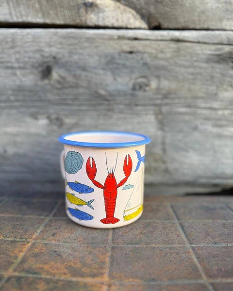 Salty Seas Enamel Mug 16oz featuring nautical designs with lobster and fish illustrations, perfect for hot or cold drinks.