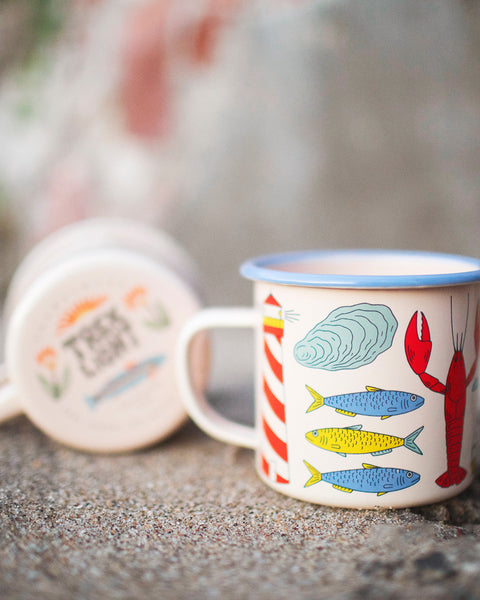 Salty Seas Enamel Mug 16oz featuring colorful nautical designs with fish and lobster, perfect for hot or cold beverages.
