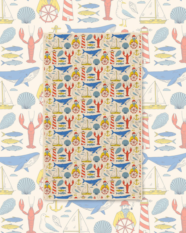 Salty Seas Kitchen & Tea Towel featuring vibrant nautical patterns of sea life and maritime elements.