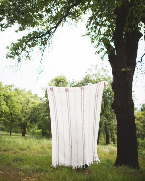 Cozy outdoors with the Silverton Blanket, handwoven in Mexico, perfect for any setting.