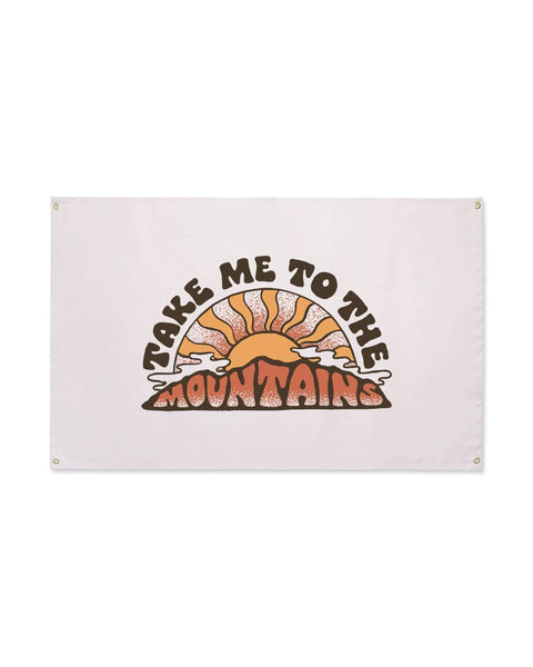 Take Me To The Mountains Canvas Flag in pale blush with a retro orange sunburst over mountains, brass grommets, on white